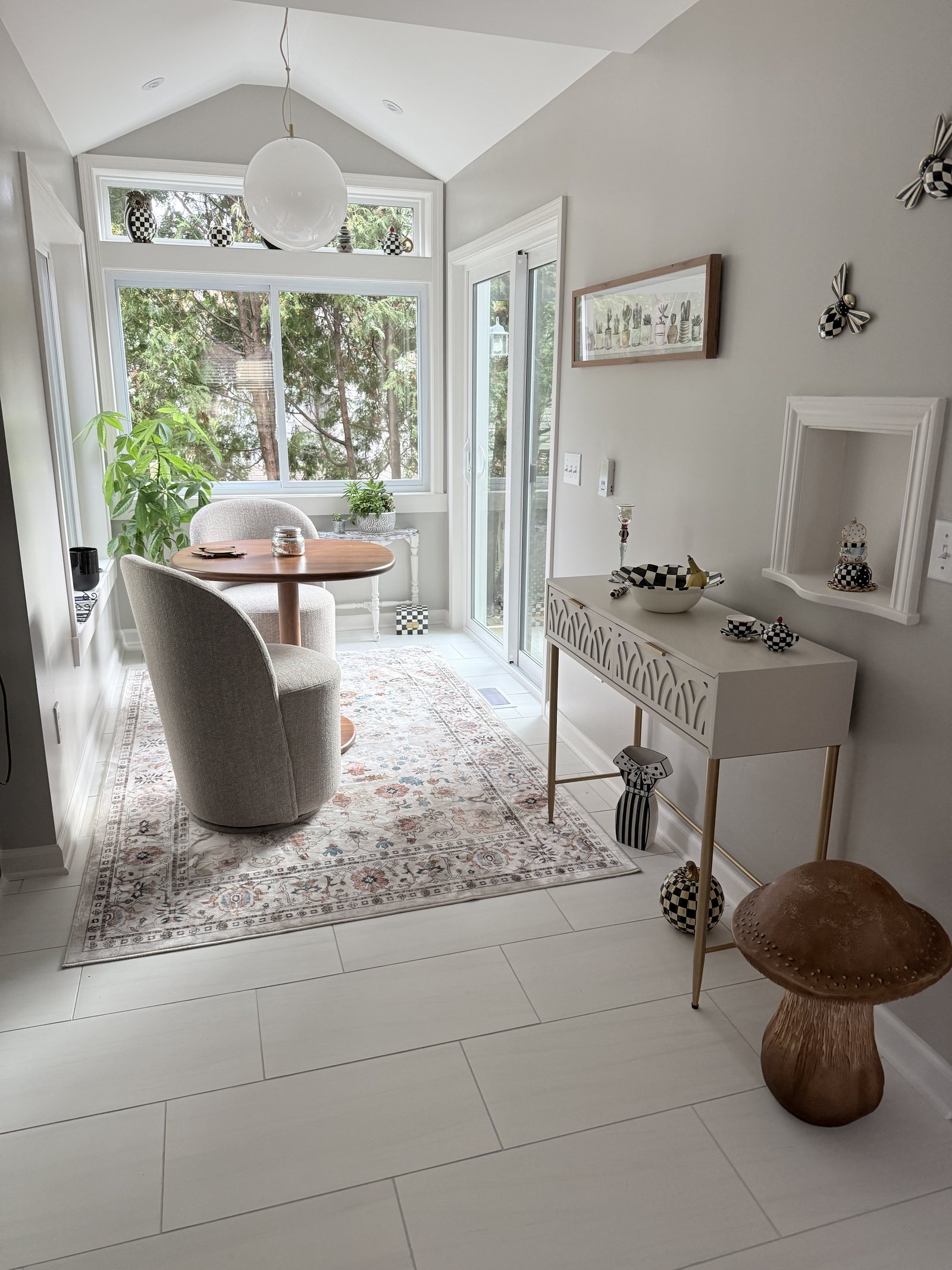 Sunroom with a vaulted ceiling and full-height windows
