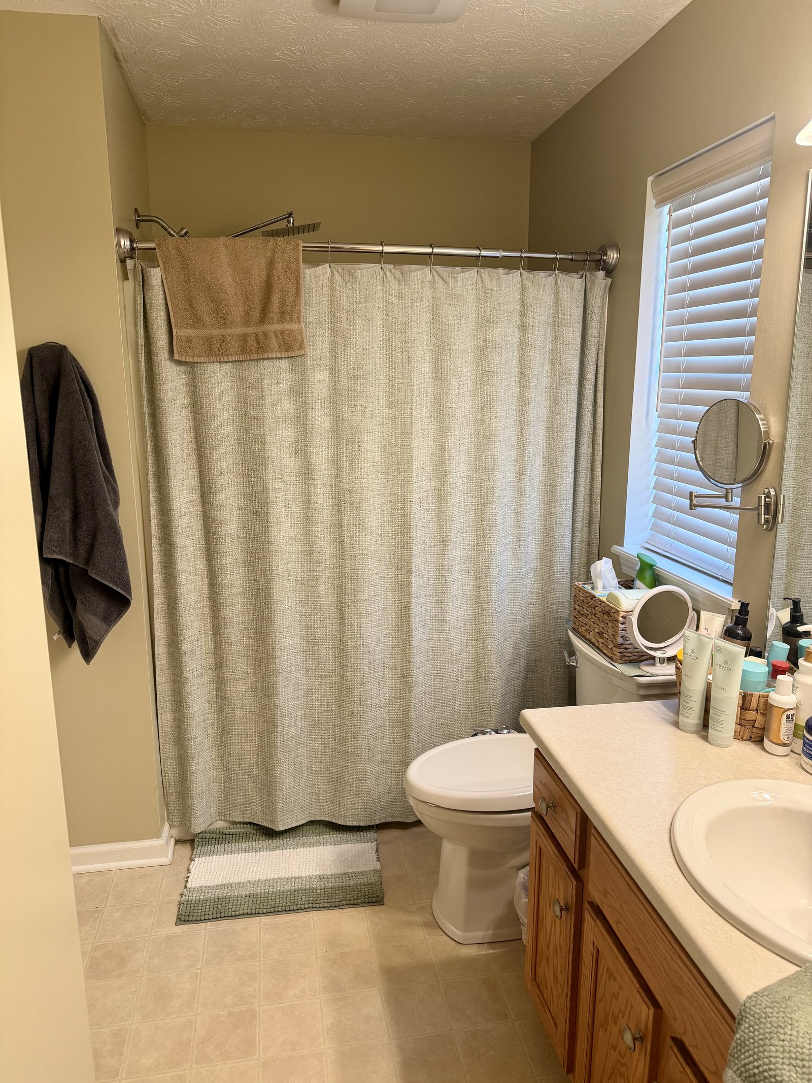 The tub behind a shower curtain — before Dreamspace renovated it